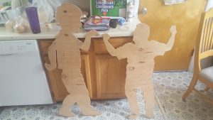 Plywood silhouettes of Winchester and John Fenley