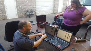 Dan (left) designs a part, while Ashley (right) prepares to do chasing and repousse