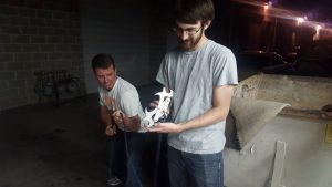 Kelie (right) shows off his Batman grappling hook